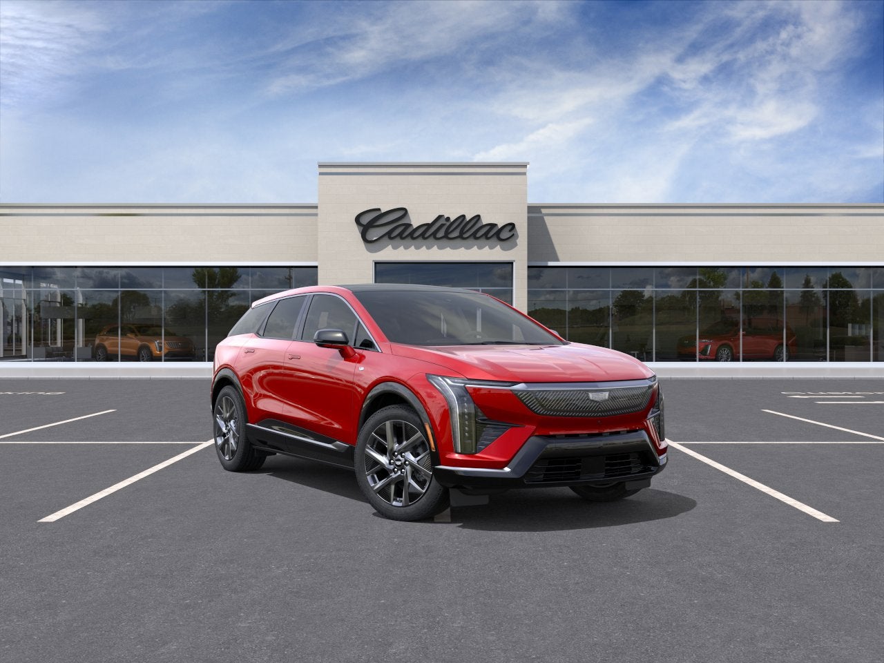 2026 Cadillac OPTIQ Luxury in Radiant Red Tintcoat — front three-quarter view