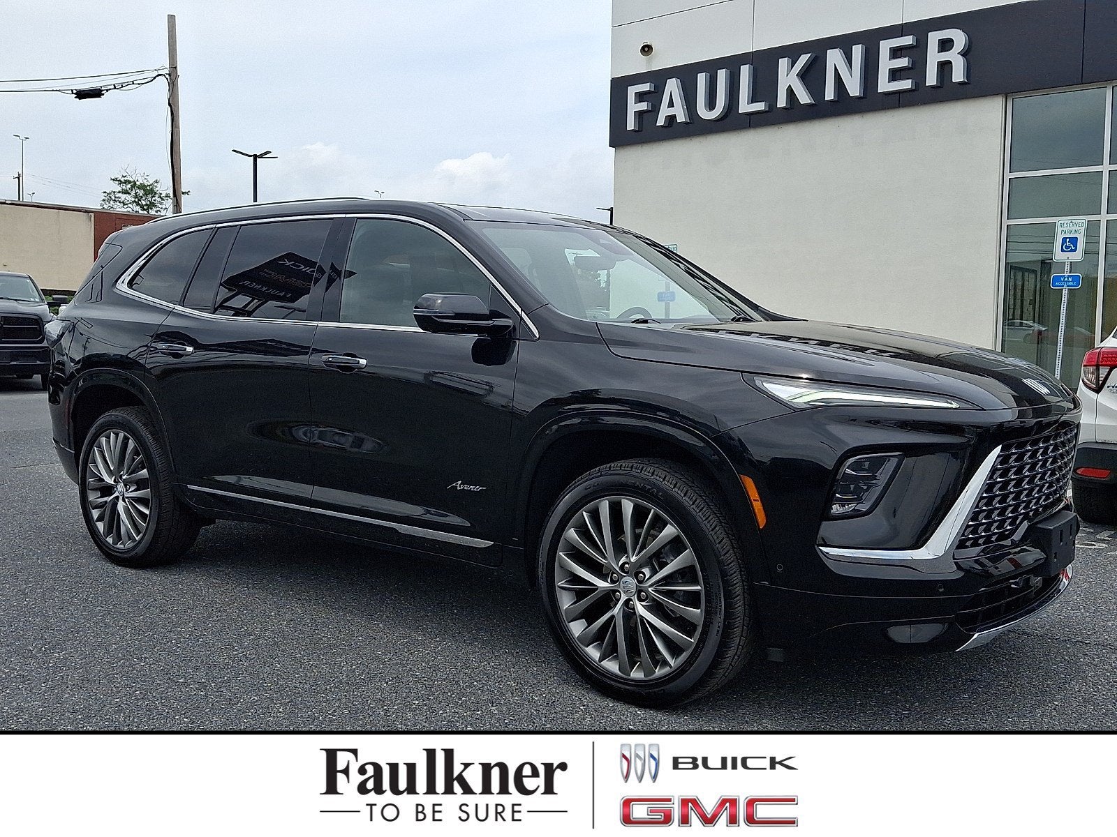 2025 Buick Enclave Avenir in Ebony Twilight Metallic — front three-quarter view