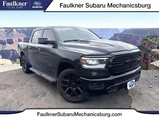 2023 RAM 1500 Laramie 4x4 Crew Cab 5'7" Box in Diamond Black Crystal Pearlcoat — front three-quarter view