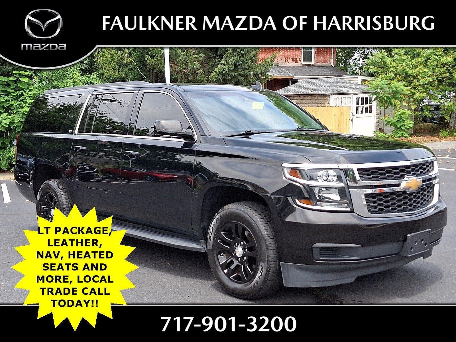 2019 Chevrolet Suburban 4WD 1500 LT in Black — front three-quarter view