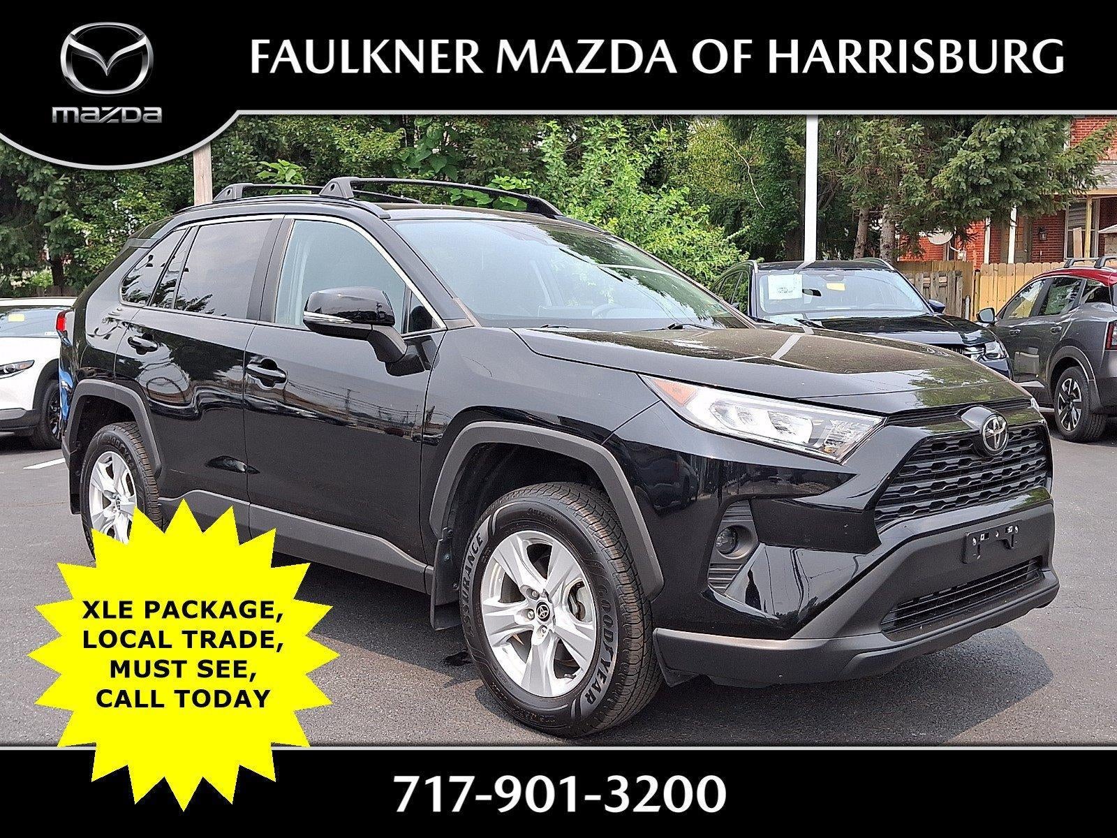 2021 Toyota RAV4 XLE AWD (Natl) in Midnight Black Metallic — front three-quarter view